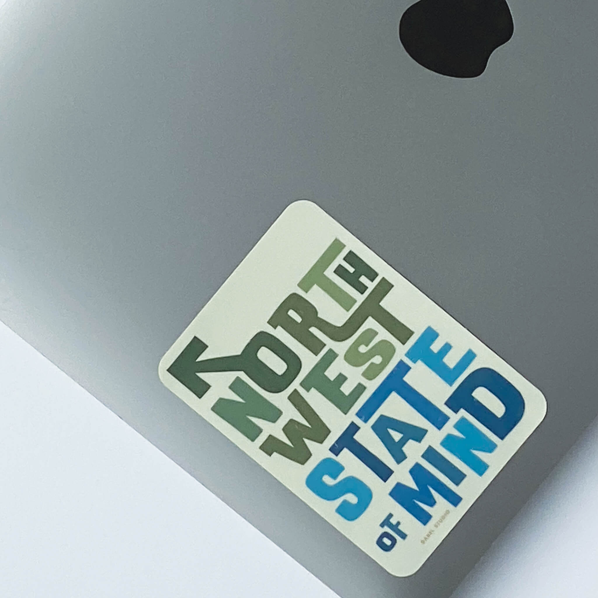 Sticker of 'northwest state of mind' design on laptop